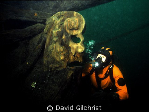 Diver examines the original figurehead on the Brig Sandus... by David Gilchrist 